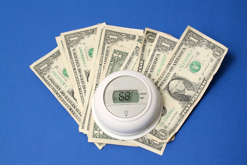 5 Ways to Save Money on Your AC and Summer Monthly Bills - Thermostat and money