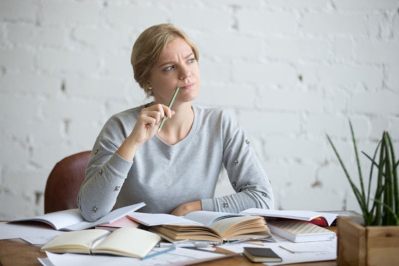 Woman At Desk Hears a Noise