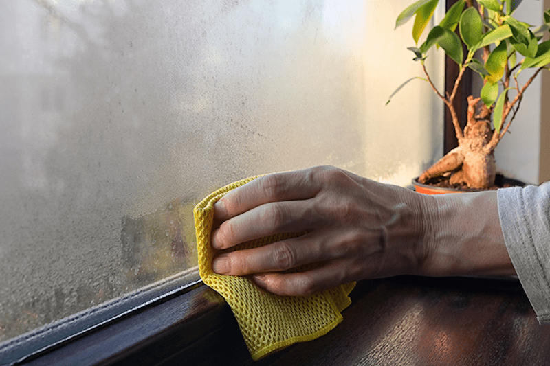 wiping condensation from the windowsill